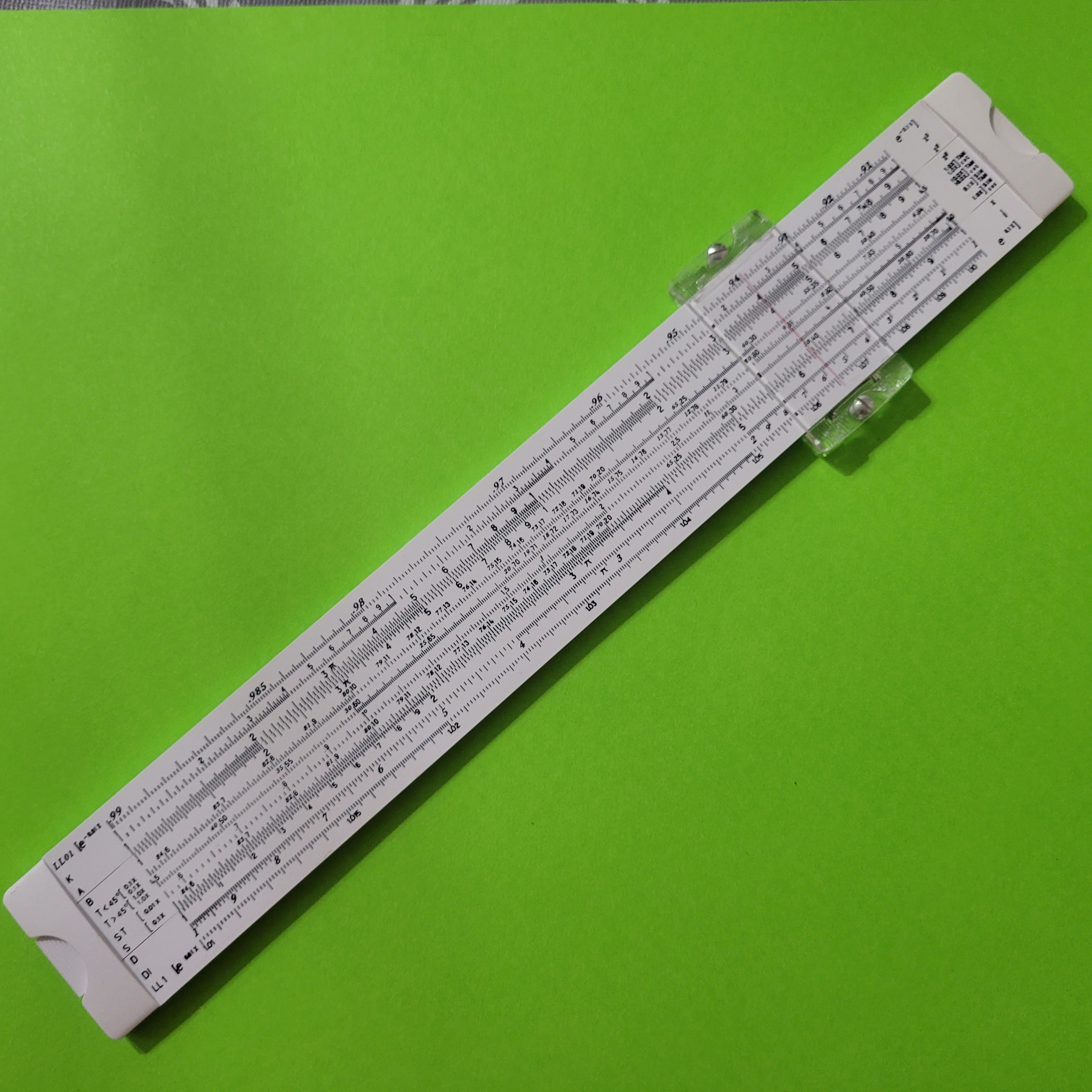 An image of the back of a Sterling Decimal Trig Multi-Log Slide Rule No.594 slide rule